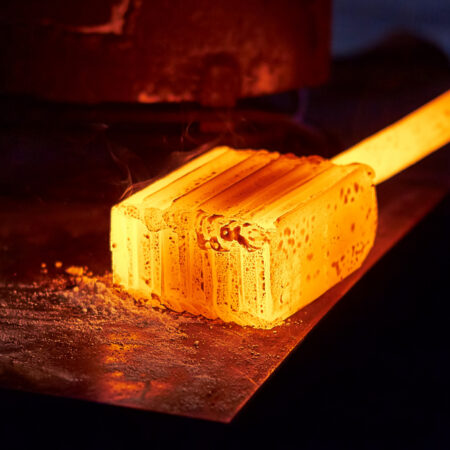 Glowing,Iron,Ingot,On,The,Table.,Hot,Metal,Workpiece,For